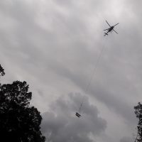 Helicopter transporting Exploration Drill Masters (EDM) 30K-HP Diamond Drill.