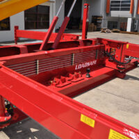 Close side view of Schramm Loadsafe trailer mounted automated pipe & casing handling system