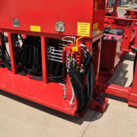 Close up of Schramm Loadsafe trailer mounted automated pipe & casing handling system