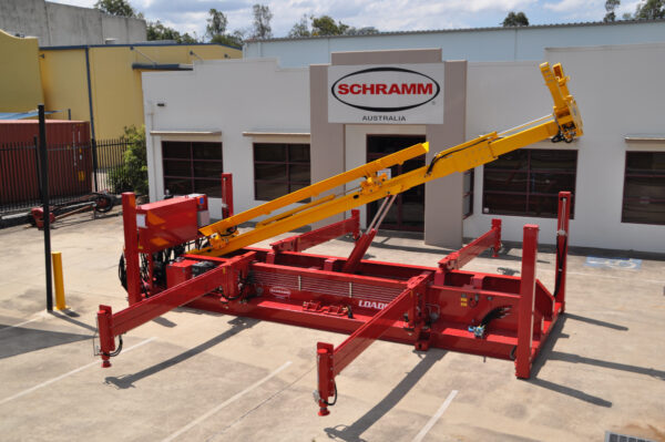 Schramm Loadsafe trailer mounted automated pipe & casing handling system in parking lot outside of Schramm's Australia location.