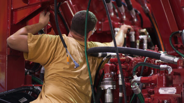Employee working in servicing Schramm Engineered drill rig parts.
