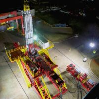Overhead view of the Schramm T500XD telemast series drill working at night.
