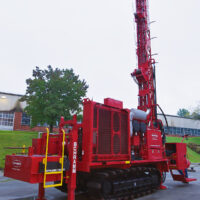 Schramm T450GT compact maneuverable drill rig with GEOCASE casing rotator system.
