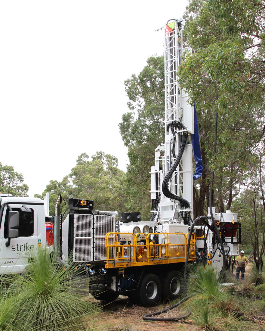 Schramm T450 Rig Outside Next to Tall Trees.