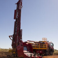 Schramm T685i drill rig in the field on a clear day.