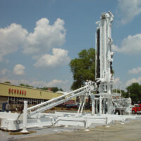 Schramm TXD LoadSafe trailer mounted automated pipe system and drill rig in the parking lot outside of a Schramm location.