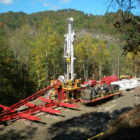 Schramm TXD LoadSafe trailer mounted automated pipe system and drill rig on-site.